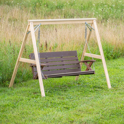 Handcrafted Amish made A-frame stand in natural wood finish supporting a dark brown hanging porch swing, set outdoors on green grass; featured in Home & Decor and Outdoor Furniture collections.