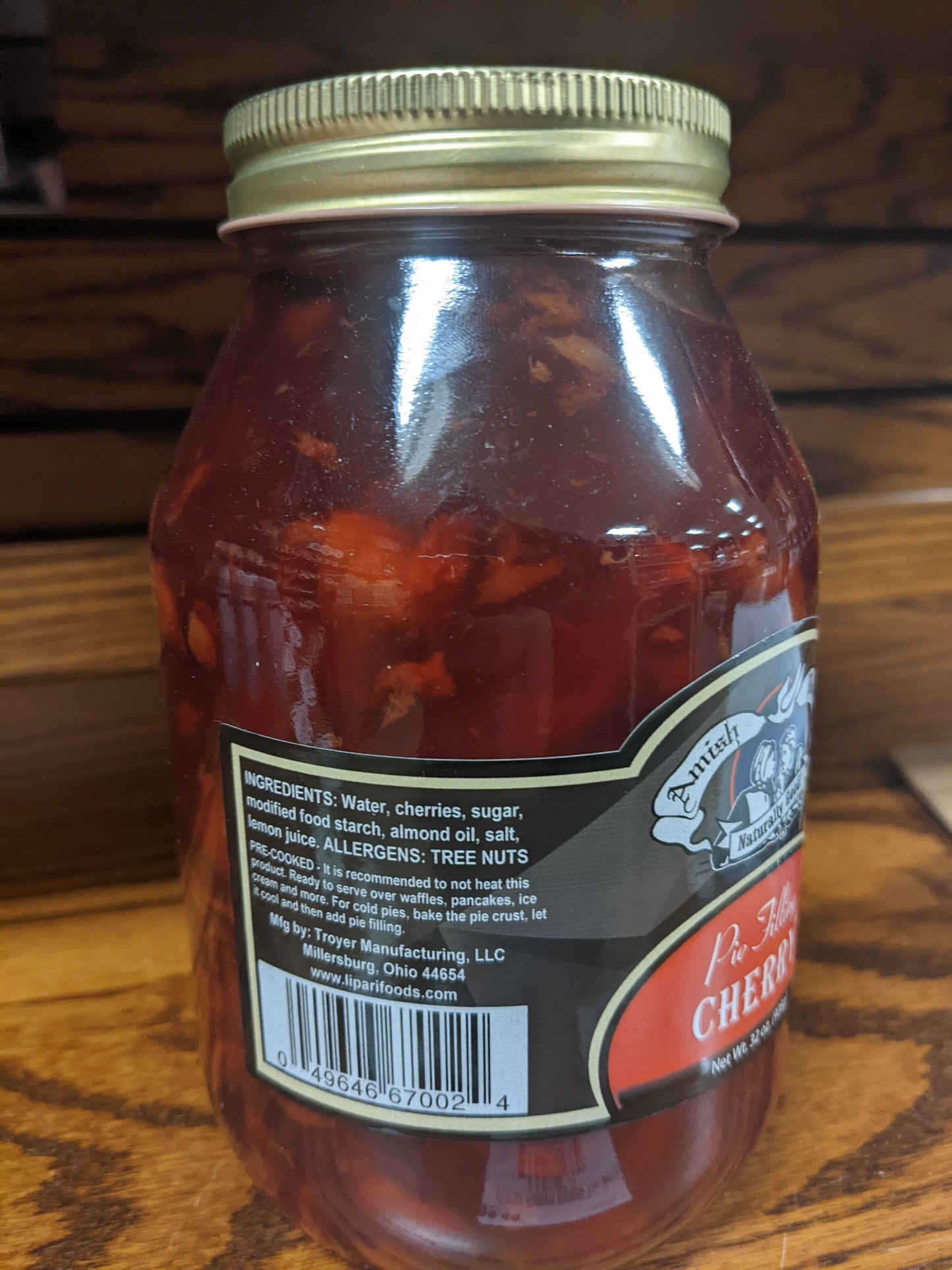 Handcrafted jar of Amish-made cherry pie filling with visible fruit pieces, naturally prepared without corn syrup or artificial coloring, part of Kitchen & Food, Pantry, USA Made, and Best Sellers collections.