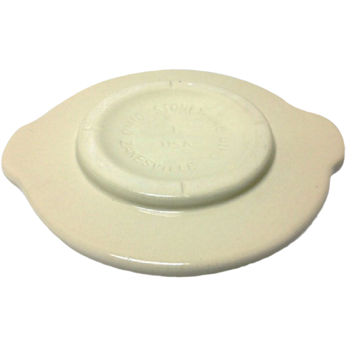 Cream-colored stoneware crock cover with side handles and raised center, handcrafted in USA, ideal for food preservation and fermenting in kitchen and pickling collections.