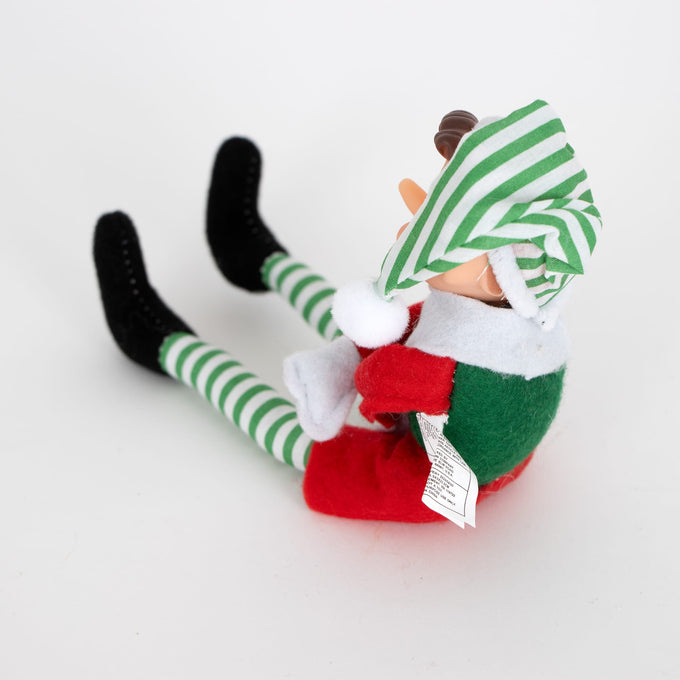 Posable retro-style Christmas elf ornament in green and red fabric with striped green and white tights and a matching hat, perfect for Home & Decor and Holiday Decor collections.