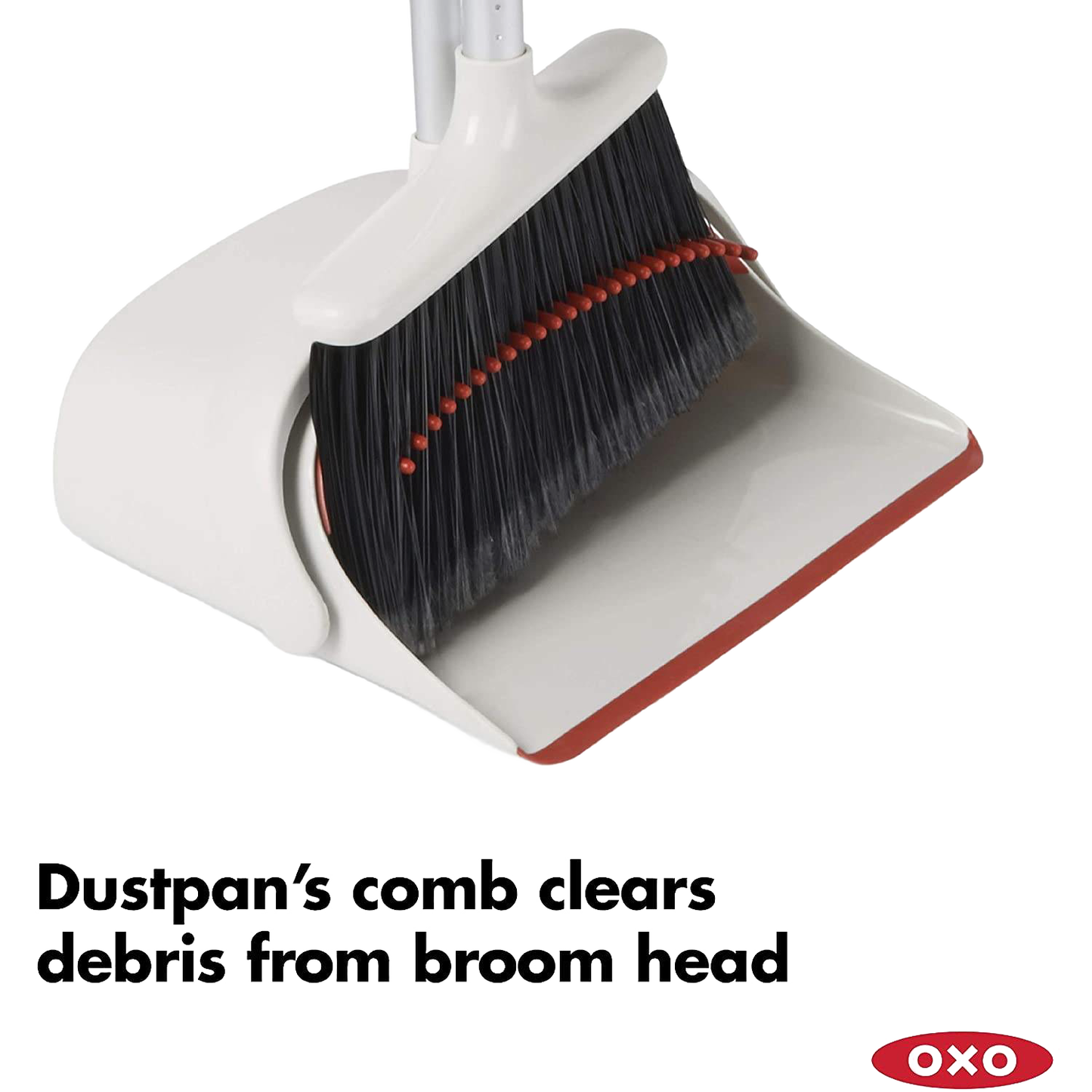 Extra-large dustpan with comb edge removing debris from black flagged bristles on an extendable broom, designed for efficient cleaning in Home & Decor and Household Cleaning collections.
