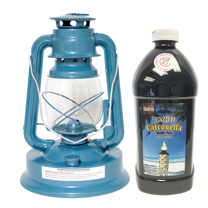 Blue metal oil lantern with clear glass globe beside a large black plastic bottle of citronella torch fuel, ideal for outdoor use in camping, garden, pest control, and emergency supplies collections.