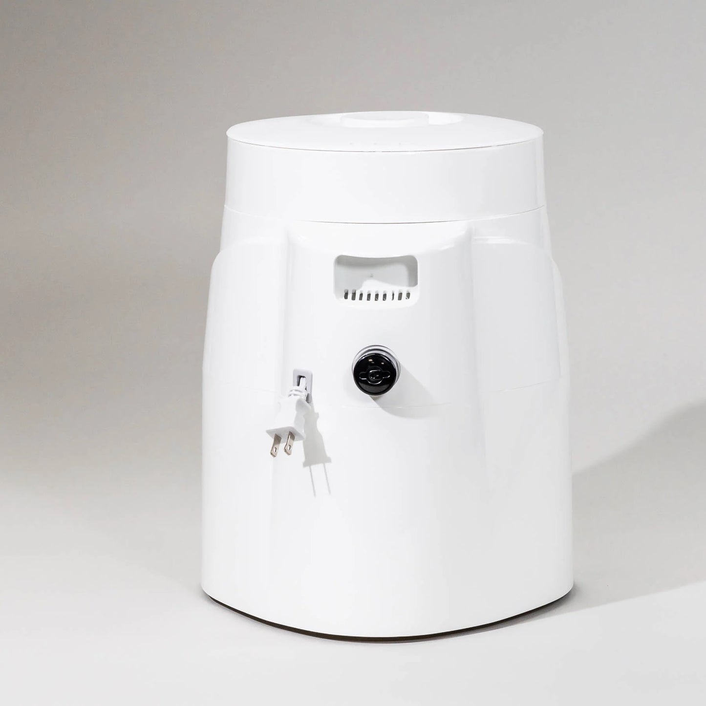 White electric grain mill with simple rounded design, featuring adjustable speed control and power cord, suitable for Kitchen & Food, Grain Mills, and Bread Making Supplies collections.
