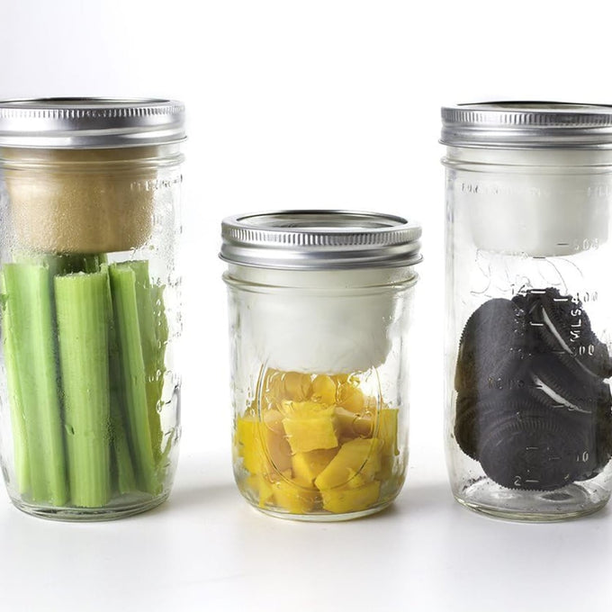 Three clear glass wide-mouth jars with metal lids, each fitted with a white divider cup separating fresh celery, pineapple chunks, and black olives, ideal for Kitchen & Food, Kitchen Gadgets, Storage and Serving, USA Made, and Best Sellers collections.
