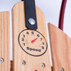 Close-up of a handcrafted wooden sled panel featuring a speedometer-style decal with numbers and a red needle pointing to six, showcasing quality wood and metal hardware in USA Made Children's Toys and Outdoor Play collections.