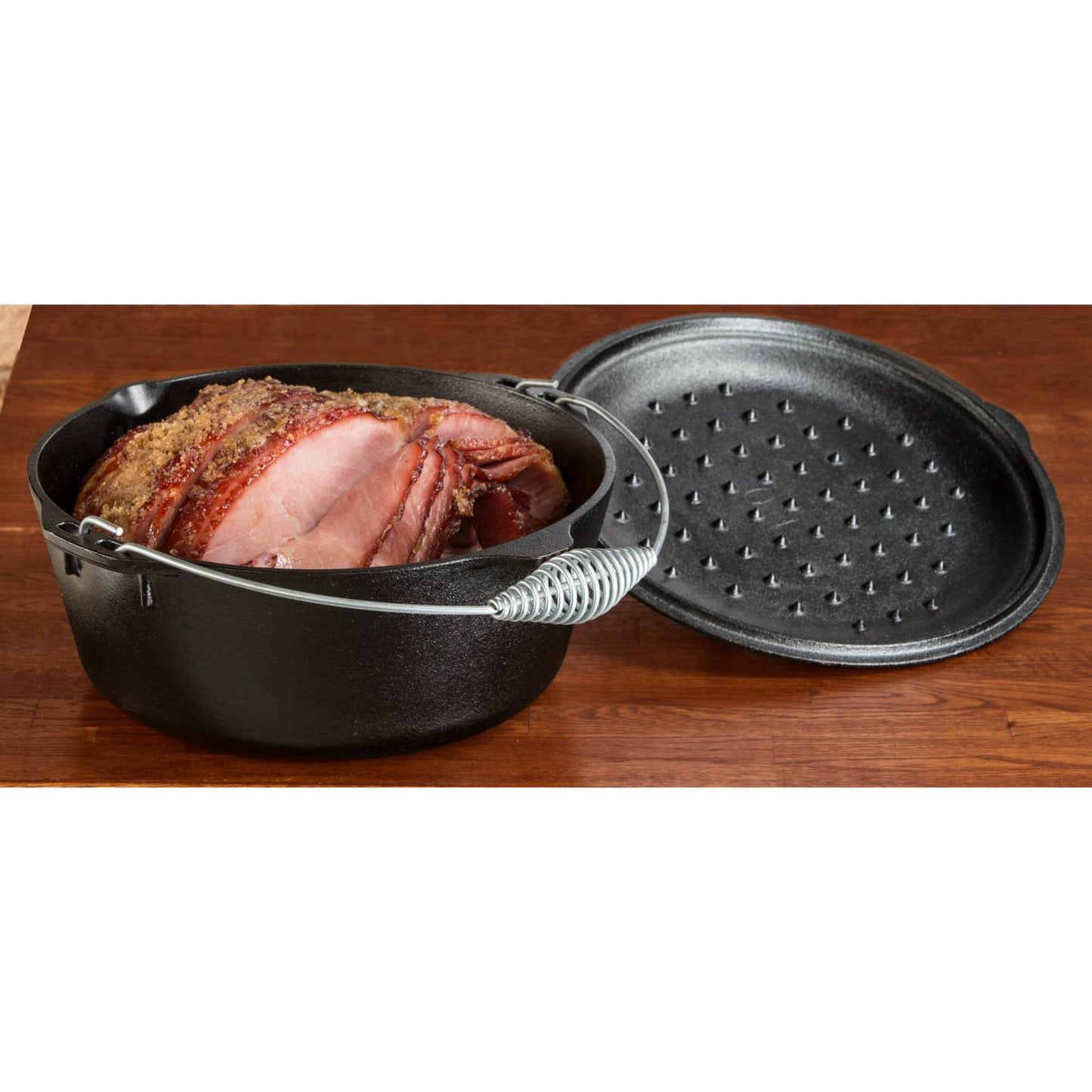 Lodge Logic cast iron Dutch oven with spiral handle and self-basting lid, pre-seasoned and ready for roasting, stewing, and baking in Kitchen & Food, Cookware, Cast Iron, USA Made collections.