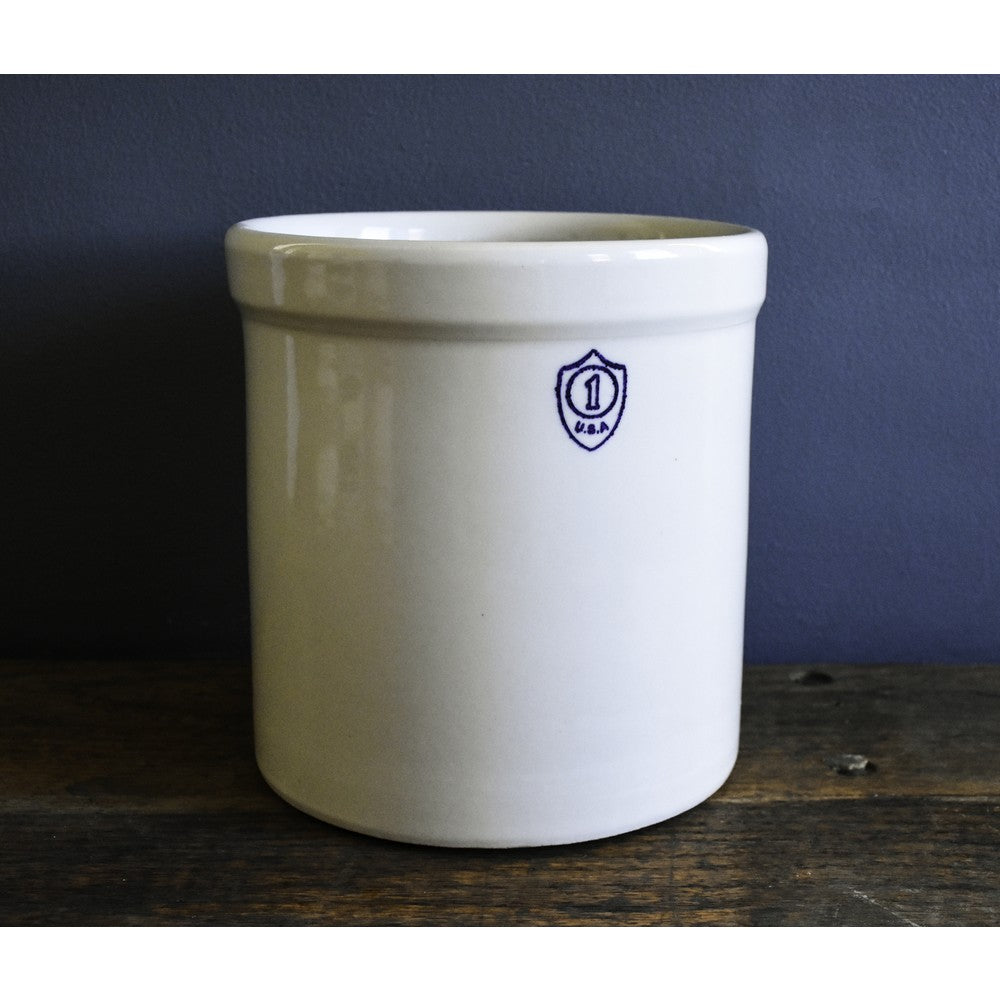White stoneware crock with a stamped one-gallon number and USA mark, handcrafted for food preservation and fermenting, featured in Home & Decor and Kitchen & Food collections.