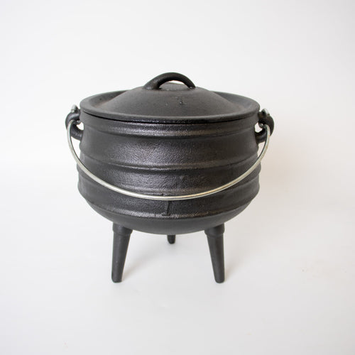 Handcrafted cast iron campfire kettle with round shape, sturdy metal bail handle, and three legs, designed for durable outdoor cooking in Farm, Garden & Tool, Camping, Best Sellers, and Promo Eligible collections.