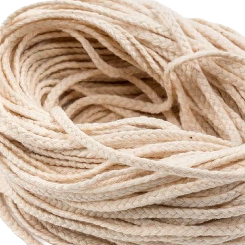 Close-up of natural cotton flat-braid wick material with 30-ply strands, ideal for making pillar or taper candles, featured in Lamps & Lighting and Candlemaking Supplies collections.