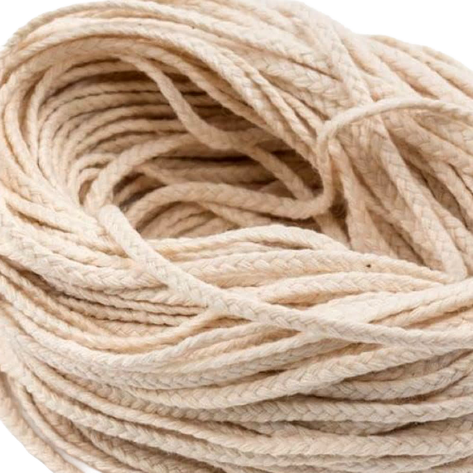 Close-up of natural cotton flat-braid wick material with 30-ply strands, ideal for making pillar or taper candles, featured in Lamps & Lighting and Candlemaking Supplies collections.
