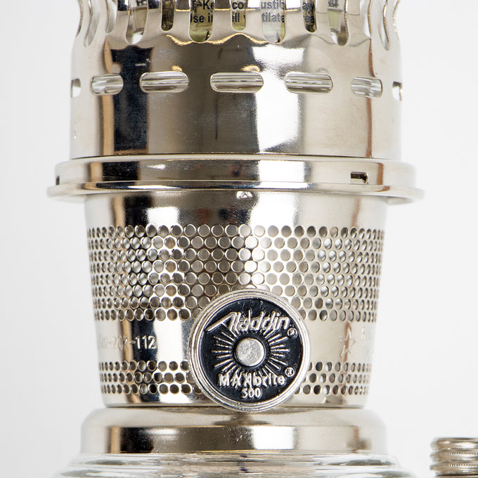 Close-up of a polished metal wick adjustment knob marked "Aladdin MaxBrite 500" on a handcrafted vintage-style oil lamp, perfect for Lamps & Lighting and Best Sellers collections.