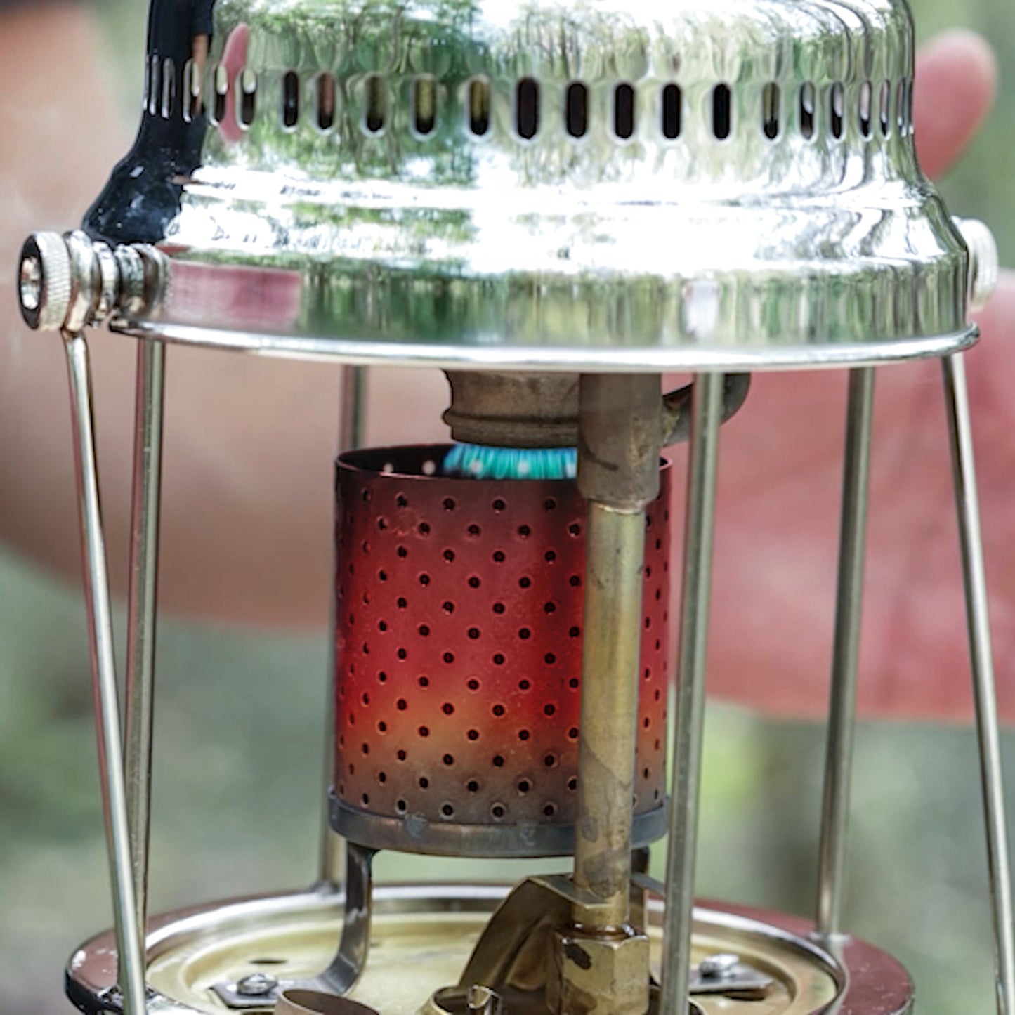 Close-up of a stainless steel radiator mounted on a red perforated heater chamber, featuring handcrafted components for use in Lamps & Lighting, Parts and Accessories, Other Parts, and Best Sellers collections.