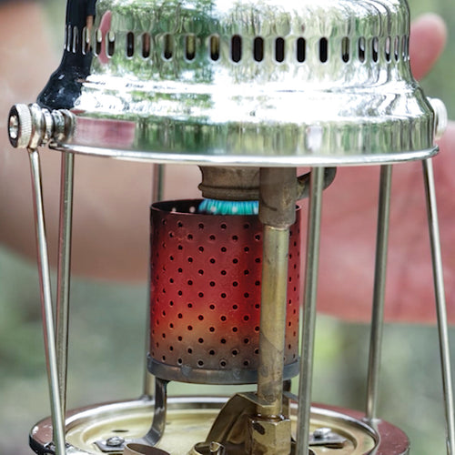 Close-up of a stainless steel radiator mounted on a red perforated heater chamber, featuring handcrafted components for use in Lamps & Lighting, Parts and Accessories, Other Parts, and Best Sellers collections.