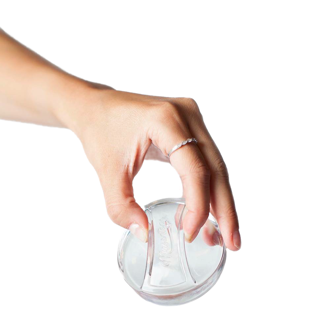 Hand holding a clear, handmade glass fermentation weight designed to keep food submerged, ideal for Kitchen & Food, Food Preservation, Fermenting and Pickling, and Best Sellers collections.