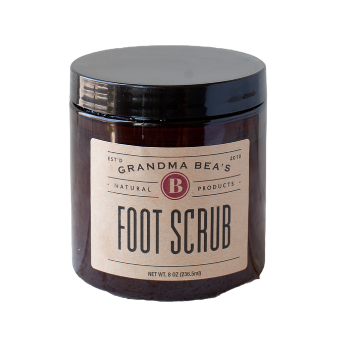 Amber glass jar of handcrafted foot scrub with a simple beige label, made in USA, ideal for Health & Wellness, Balms, Creams and Lotions, and Best Sellers collections.