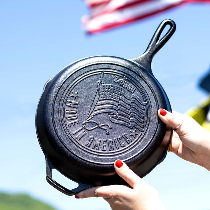 Handcrafted cast iron skillet with an embossed American flag and "Made in America" text, showcasing durable USA made cookware, perfect for Kitchen & Food and Cast Iron collections.