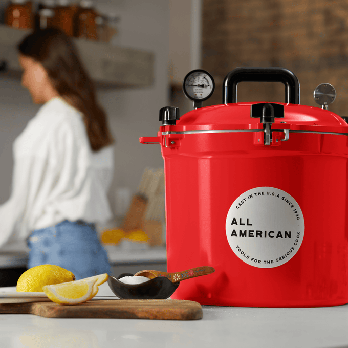 Handcrafted bright red pressure canner with secure locking lid, built-in pressure gauge, and sturdy handle, made in USA for Kitchen & Food, Food Preservation, Canning, and Best Sellers collections.