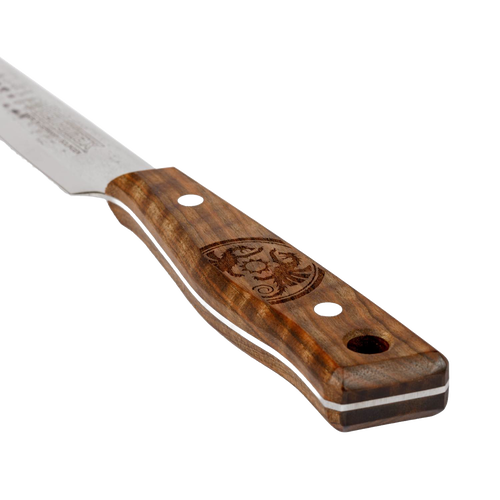 Close-up of a handcrafted utility knife handle made of polished walnut wood with decorative engraving, designed for outdoor cooking and included in camping and kitchen collections.