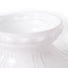 Close-up of a glossy white glass lamp shade with embossed detailing, designed to soften and distribute light, featured in Lamps & Lighting and Lamp Shades collections.