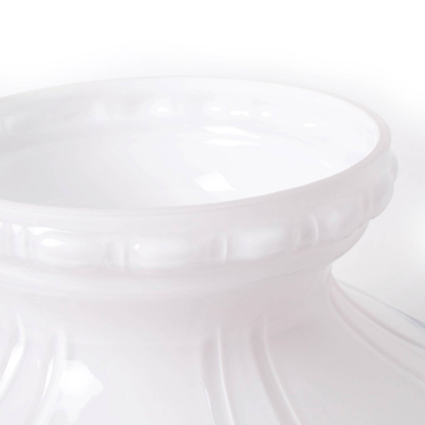 Close-up of a glossy white glass lamp shade with embossed detailing, designed to soften and distribute light, featured in Lamps & Lighting and Lamp Shades collections.