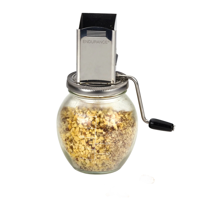 Vintage-style nut grinder with stainless steel mechanism mounted on a glass jar featuring measurement lines, designed for Kitchen & Food, Food Prep, and Cooking and Baking Helpers collections.