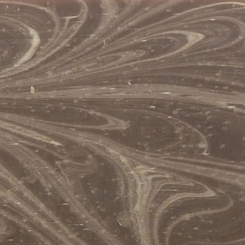 Close-up of a handcrafted natural soap bar featuring a marbled swirl pattern in soft brown tones, made in small batches in the USA, fitting Health & Wellness and Soaps collections.