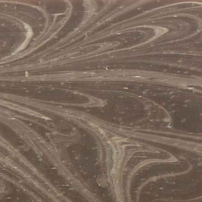 Close-up of a handcrafted natural soap bar featuring a marbled swirl pattern in soft brown tones, made in small batches in the USA, fitting Health & Wellness and Soaps collections.
