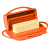 Orange flip-top butter dish featuring a neatly cradled stick of butter and a matching spreader, designed for tidy storage and easy use in Kitchen & Food and Kitchen Gadgets collections.