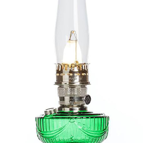 Handcrafted oil lamp with an emerald green glass font and brass trim, designed for Lamps & Lighting, Oil Lamps, Table Lamps, Best Sellers, and Promo Eligible collections.