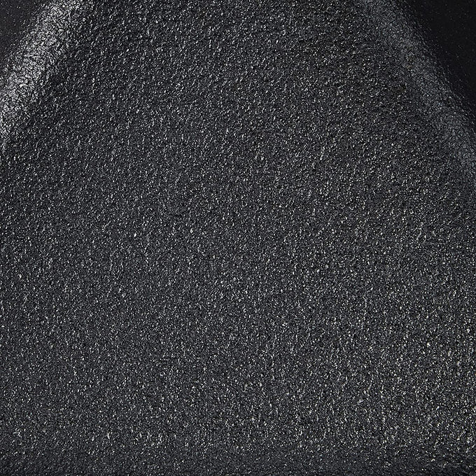 Close-up of the seasoned black cast iron surface with textured finish, showcasing durable craftsmanship ideal for Kitchen & Food, Cookware, Cast Iron, USA Made, and Best Sellers collections.