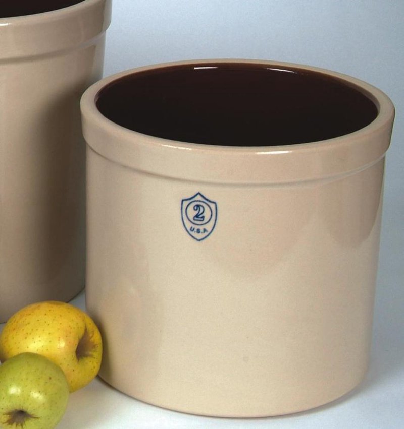 Cream-colored stoneware crock with dark brown interior and a stamped "2" indicating capacity, surrounded by fresh apples, ideal for Kitchen & Food, Food Preservation, Fermenting and Pickling, USA Made, and Best Sellers collections.