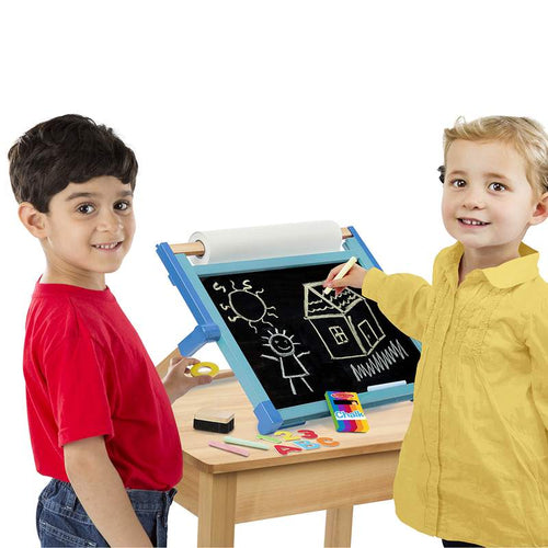 Two children using a handcrafted double-sided tabletop easel with a chalkboard side showing colorful drawings, including a sun, house, and stick figure, in a bright playroom setting, featured in Toys, Books & Games and Children's Toys collections.