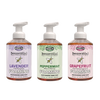 Three bottles of natural foaming hand soap in Lavender, Peppermint, and Grapefruit scents with colorful labels, part of USA Made health and wellness soap collections.