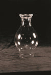 Clear crimp top glass lamp chimney with a 3-inch base and rounded bulge, designed as a durable replacement part featured in Lamps & Lighting, Parts and Accessories, Chimneys and Globes collections.