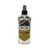 Clear spray bottle of handcrafted gun cleaner and oil with a black nozzle and label featuring a handgun graphic, part of Home & Decor, Household Cleaning, and USA Made collections.