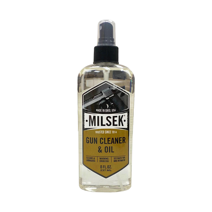 Clear spray bottle of handcrafted gun cleaner and oil with a black nozzle and label featuring a handgun graphic, part of Home & Decor, Household Cleaning, and USA Made collections.