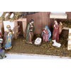 Handcrafted resin nativity set featuring nine detailed figurines with golden highlights arranged around a moss-covered stable, perfect for Home & Decor, Holiday Decor, Best Sellers, and Promo Eligible collections.
