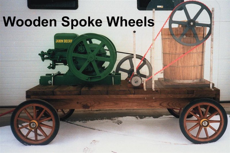 Wooden trailer with six-spoke wooden wheels, featuring a green 1.5 hp engine connected to a large wooden barrel, part of Specialty Equipment and Kitchen & Food collections.