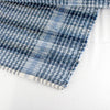 Close-up of a handwoven blue denim rug with a textured plaid pattern and finished edge, showcasing durable craftsmanship in Home & Decor and USA Made collections.