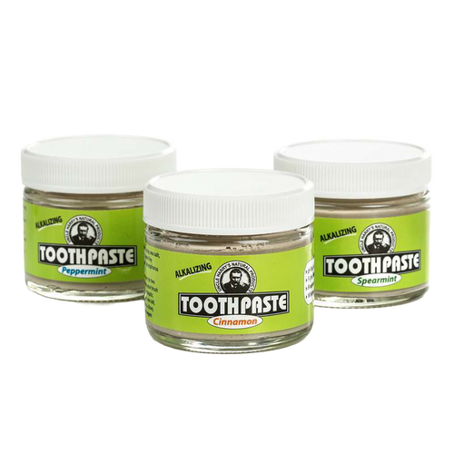 Three small glass jars of handcrafted all-natural alkalizing toothpaste in peppermint, cinnamon, and spearmint flavors with white lids, featured in Health & Wellness, Grooming and Personal Hygiene, USA Made, and Best Sellers collections.
