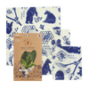 Three-piece set of handcrafted reusable food wraps in white with blue bear, bee, and honeycomb illustrations, eco-friendly and made in USA for Kitchen & Food and Storage and Serving collections.