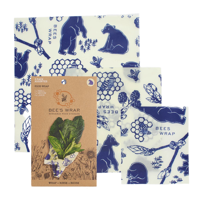 Three-piece set of handcrafted reusable food wraps in white with blue bear, bee, and honeycomb illustrations, eco-friendly and made in USA for Kitchen & Food and Storage and Serving collections.