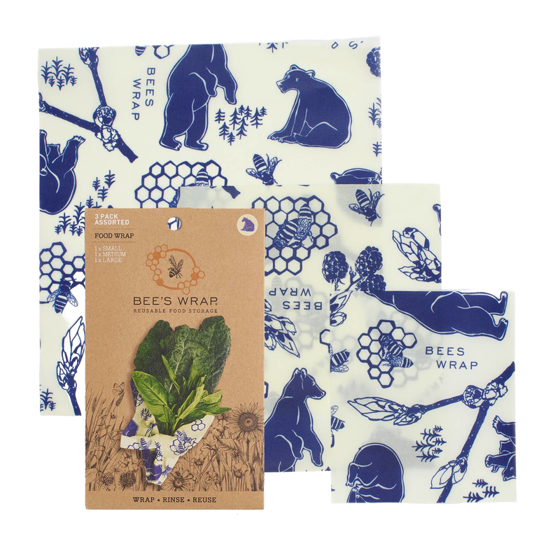 Three-piece set of handcrafted reusable food wraps in white with blue bear, bee, and honeycomb illustrations, eco-friendly and made in USA for Kitchen & Food and Storage and Serving collections.