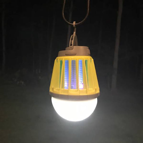 Rechargeable yellow and brown outdoor lantern glowing with bright white light and ultraviolet LED, designed for pest control, camping, and emergency use in outdoor settings.
