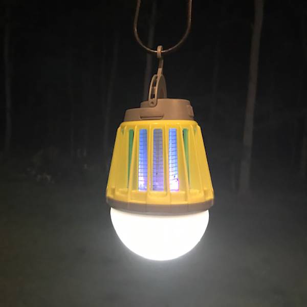 Rechargeable yellow and brown outdoor lantern glowing with bright white light and ultraviolet LED, designed for pest control, camping, and emergency use in outdoor settings.