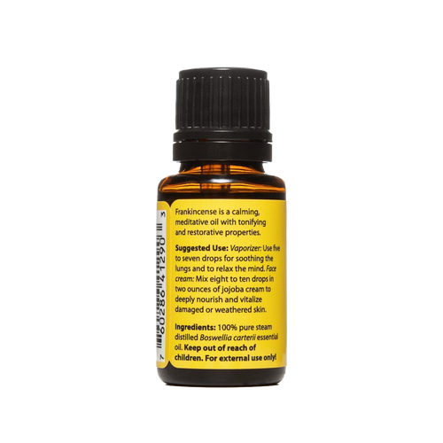 Amber glass bottle of pure steam-distilled frankincense essential oil with black cap and yellow label detailing calming, tonifying properties, made in USA, ideal for health remedies and wellness collections.