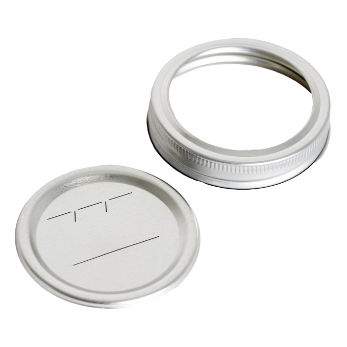 Silver-colored regular-mouth canning lid and metal band featuring BPA-free sealing compound and labeled with simple black lines, designed for Kitchen & Food and Food Preservation collections.