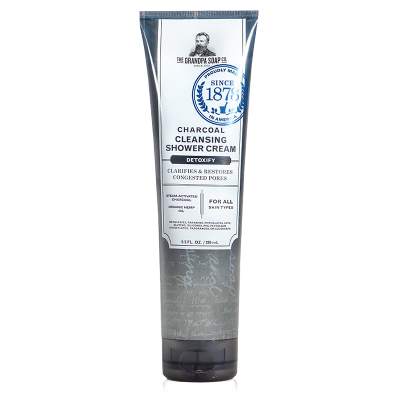 Tall gray and white tube of charcoal cleansing shower cream featuring detoxifying formula with steam-activated charcoal and organic hemp oil, from USA made health and wellness collection.