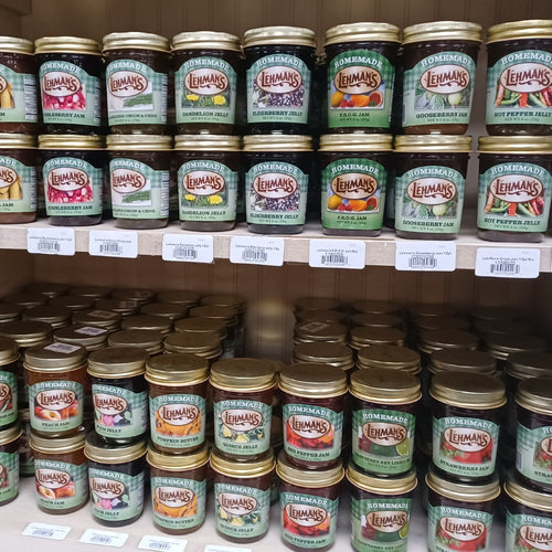 Rows of handcrafted Lehman's jams, jellies, and fruit butters in glass jars with gold lids, made in USA with all-natural ingredients, ideal for Kitchen & Food, Pantry, and Best Sellers.