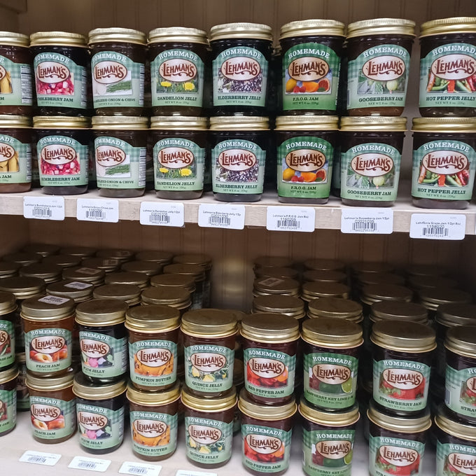 Rows of handcrafted Lehman's jams, jellies, and fruit butters in glass jars with gold lids, made in USA with all-natural ingredients, ideal for Kitchen & Food, Pantry, and Best Sellers.